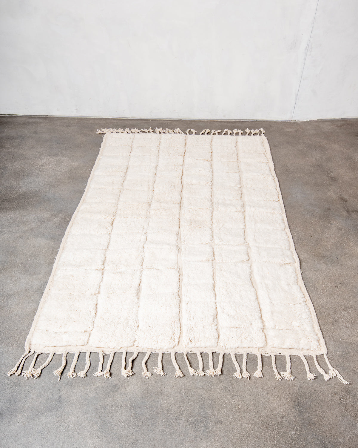 Modern, designer, handcrafted Berber rug from Morocco. Beniourain carpet with minimalist design, natural wool pile and a fluffy texture.